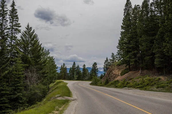 stock image Car driving on a mountain road in the Canadian Rockies.  in Banff National Park, Alberta, Canada,Montain scenic landscape. Tourism in summer