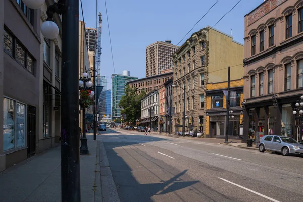 Stock image Urban view of Downtown Vancouver. The general plan of the street - old and modern buildings, roads, commercial establishments on sunny summer day. 