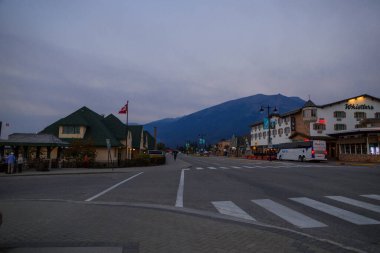 Jasper alpine city in the mountains at dawn. General panorama view of city centre. Tourism Alberta, Canada clipart