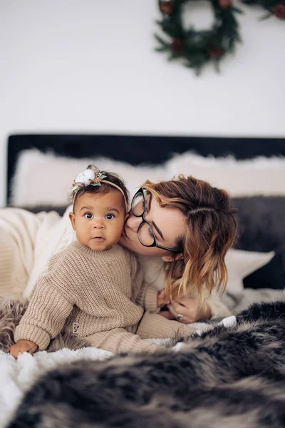 Happy Caucasian Woman Kisses Her Mixed Race Baby Daughter Background — Stock Photo, Image