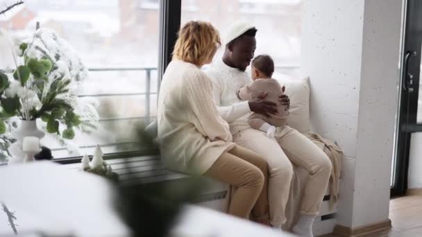 Happy Interracial Family Sits Windowsill Plays Baby Daughter Background Window — Stock Video
