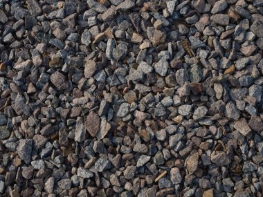Detaylı doku çakıl ve ezilmiş taşlar, doğal desenler, pürüzlü yüzey. İnşaat malzemeleri, peyzaj malzemeleri..
