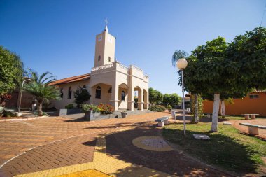 Beautiful view of the main square in Parisi, SP, showcasing the charming church and inviting green spaces clipart