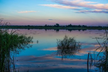 Beautiful landscape of sunset, multicolored sky, lake