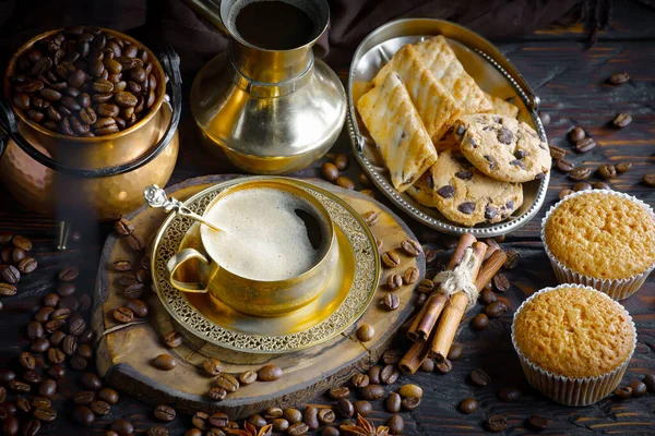 stock image Coffee in a cup on a background of coffee beans, on an old background.