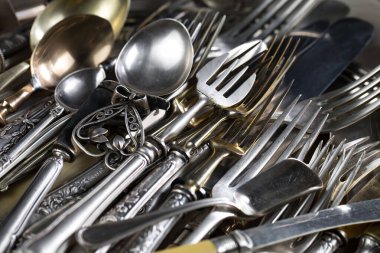 Silverware on an old background. clipart