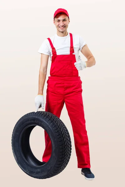 Working Man Full Growth Holds Tire White Background — Stock Photo, Image