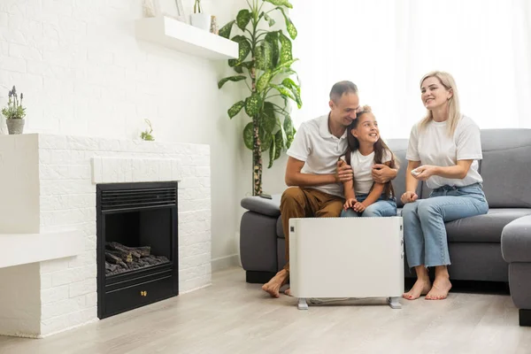 Electric Heater Home Young Family Warms Heating Radiator — Stock fotografie