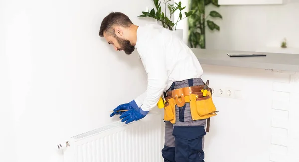 Man Work Overalls Using Wrench While Installing Heating Radiator Room — Stock Photo, Image