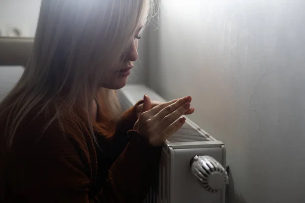Closeup Woman Warming Her Hands Heater Home Cold Winter Days — Stockfoto