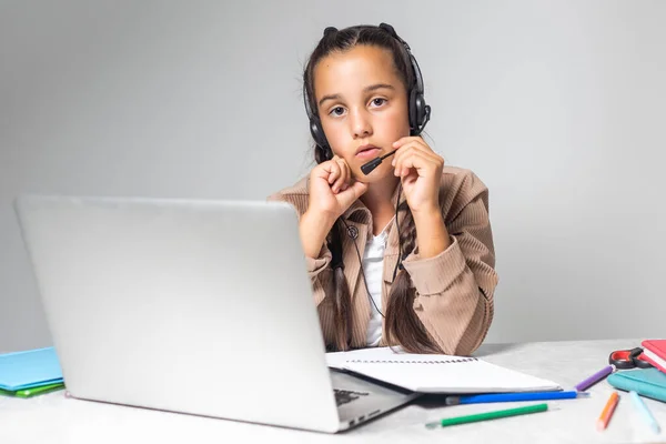 Learning Shocked Little Schoolgirl Looking Laptop Wearing Headphones Looking Computer — Stockfoto