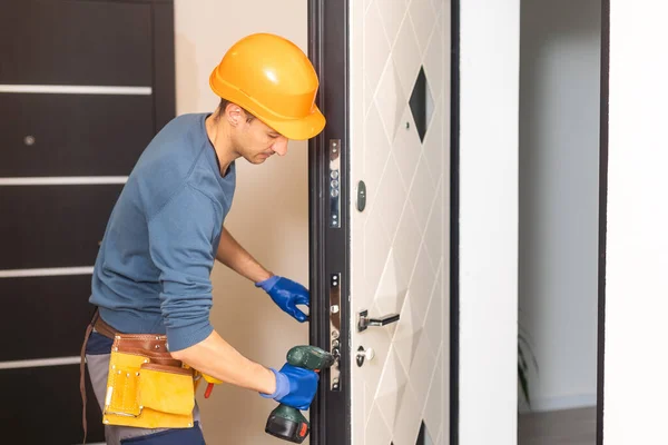 Young Handyman Installing White Door Electric Hand Drill Room — Stock Photo, Image