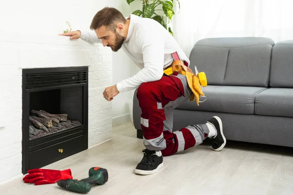 Professional Technician Sealing Electric Fireplace White Wall Room — Stock Fotó