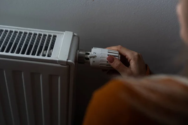 Closeup Woman Warming Her Hands Heater Home Cold Winter Days — Foto de Stock