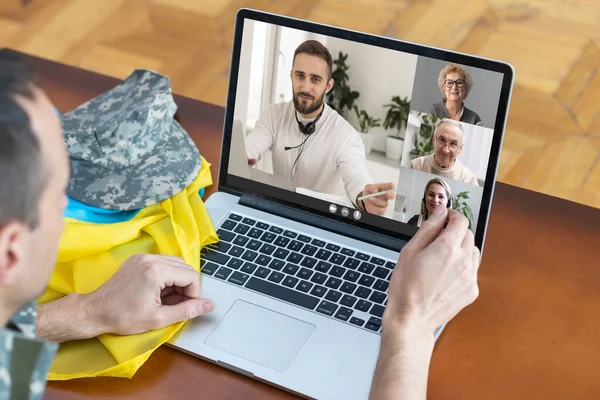 stock image video conference. Multiethnic business team using laptop for a online meeting in video call. Group of people smart working from home.