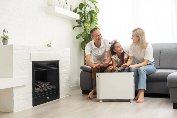 Electric Heater Home Young Family Warms Heating Radiator — Zdjęcie stockowe