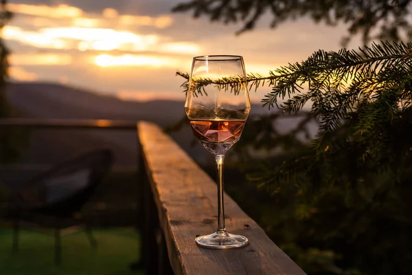 glasses of wine in mountains, closeup.