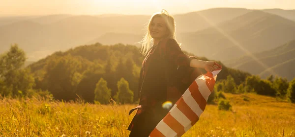 stock image young beautiful woman holding USA flag