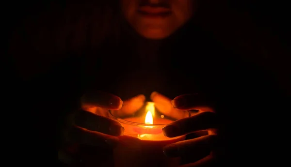 Woman Warms Her Hands Burning Candle — Stock Photo, Image