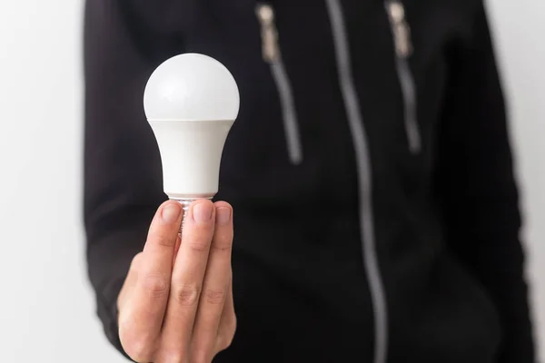 stock image light bulb on hand with white background. Energy bright and smart creativity thinking concept.