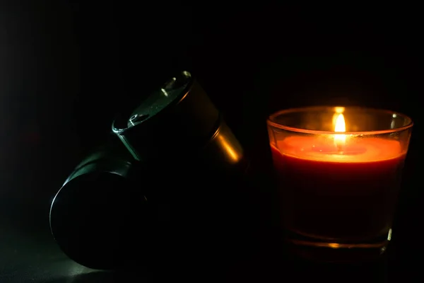 candle and toy barrel of fuel.