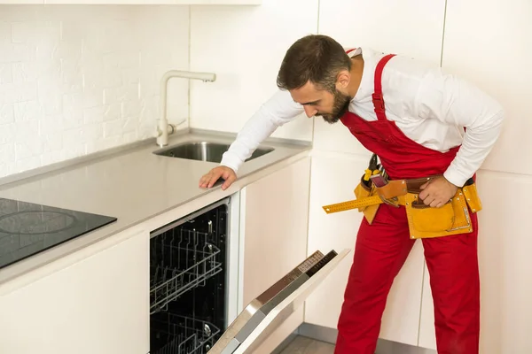 Man Repairing Dishwasher Tools — Stock Fotó