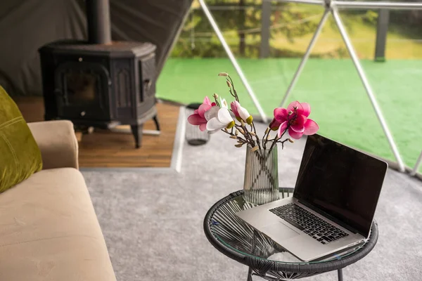 laptop in the dome camping, hygge, lifestyle concept.