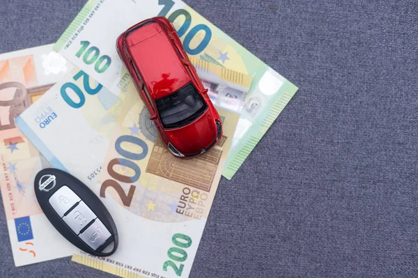 Car keychain, toy car, Euro. insurance, car loan.