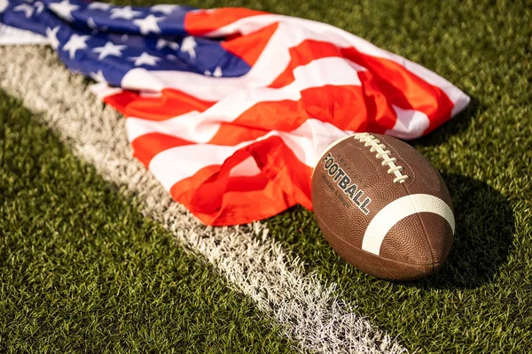 american football ball and flag.