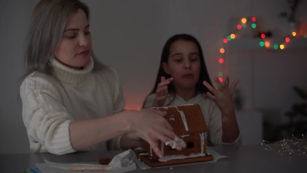 Mother Daughter Making Gingerbread Cookies House Decorating Home Christmas Concept — 비디오