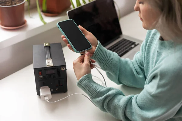 stock image Charging station for phone, tablet, laptop and other gadgets when there is no light during blackout. Generator power bank battery in the absence of electricity. Charge electric rechargeable battery