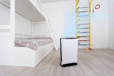 A modern humidifier in the childrens bedroom. Maintaining the climate in the apartment.