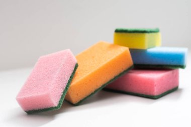 Kitchen dishcloth, cleanup concept, housework. Colorful kitchen sponges for cleaning close-up, housekeeping