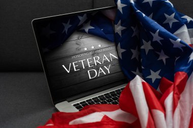 veterans day written in laptop with flag of the United States