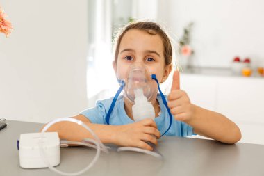 Cute little girl with nebulizer mask