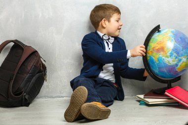 little student holding books, self-education