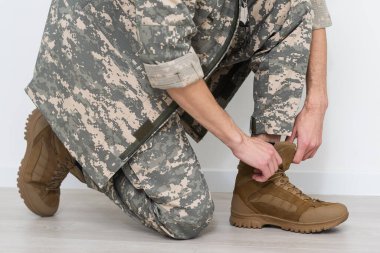 Military shoes and legs, legs of a soldier in shoes.
