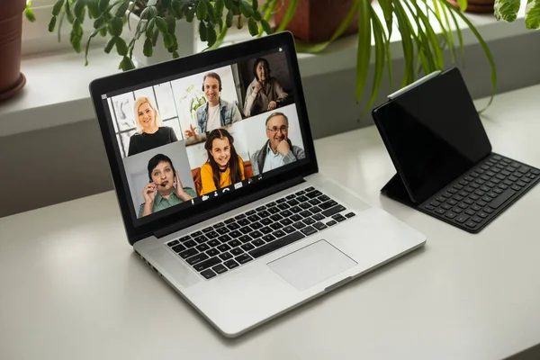 Virtual meeting online. Video conference by laptop. Online business meeting. On the laptop screen, people who gathered in a video conference to work on-line
