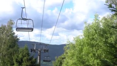 mountain cableway in summer sunny day.