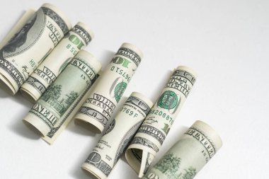 Belted roles of dollars closeup.