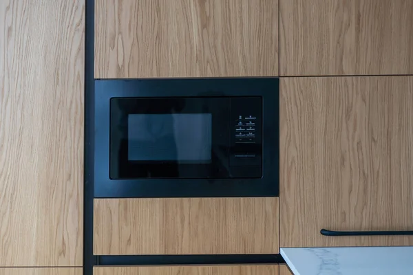 Modern built in microwave oven in the kitchen.