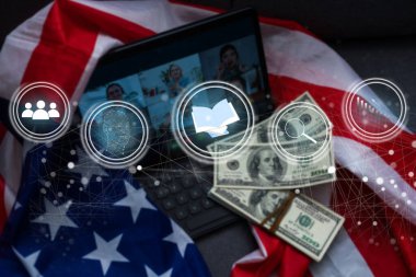 laptop computer and tablet in modern office with virtual icon diagram.