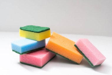 Kitchen dishcloth, cleanup concept, housework. Colorful kitchen sponges for cleaning close-up, housekeeping