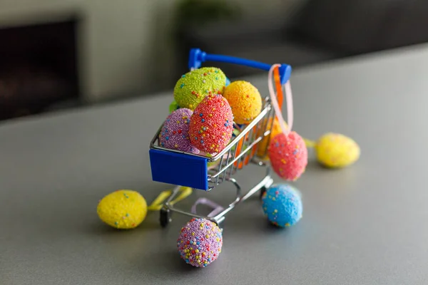 shopping cart with easter eggs for hunting or give away