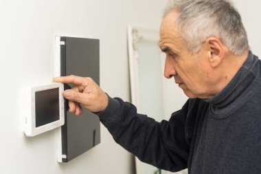 A worker repairs the intercom. Indoor intercom