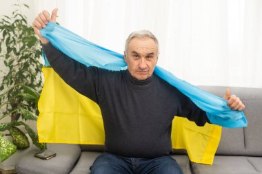 Mature man with flag of Ukraine.