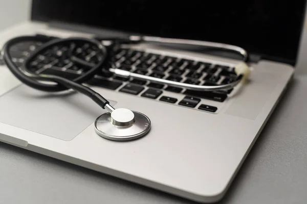 Stethoscope on a computer keyboard.