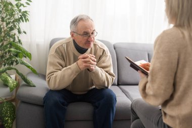 Caregiver psychologist console american senior people for mental health, geriatric psychology, Depressed senior man talking with female psychologist, desperate people, emotions sad, elderly worry,