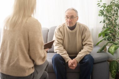 Caregiver psychologist console american senior people for mental health, geriatric psychology, Depressed senior man talking with female psychologist, desperate people, emotions sad, elderly worry,
