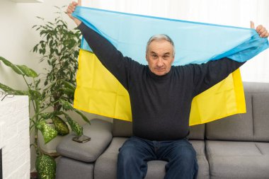 Mature man with flag of Ukraine.